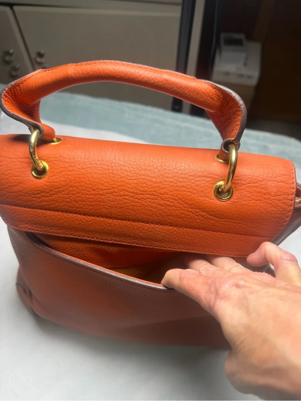 Structured Orange Leather Satchel with Top Handle and Crossbody Strap